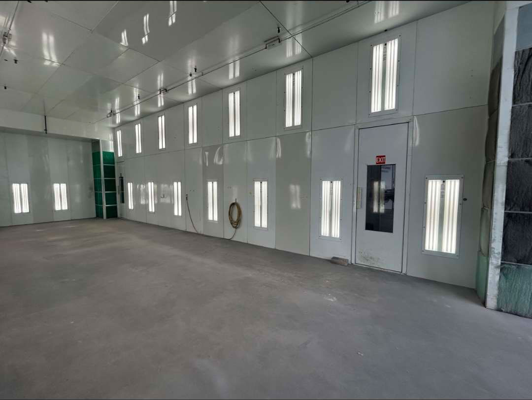 Professional vehicle refinishing facility - paint booth one